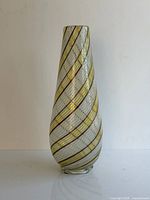 Full view of tall spiral-striped vase