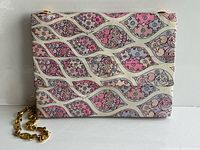 Front view showing full floral pattern and hardware