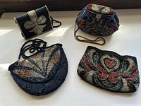 All four beaded evening purses laid out