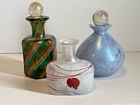 Front view of three perfume bottles