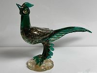 Left side view of green and gold aventurine Murano glass pheasant on clear base