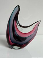 Front view of the striped art glass wave sculpture