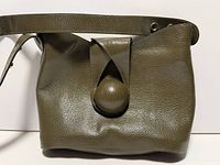 Front view showing leather texture and dome button