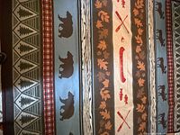 Close-up of central panel with canoe, paddles, fish and leaves