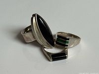 All three sterling silver rings grouped, showing faces and general condition