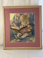 Full view of framed embroidery under mat and frame