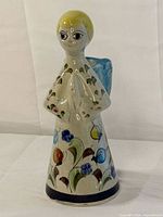 Front view of hand-painted Tonala angel candle holder