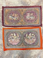 Both textile panels laid flat showing overall designs