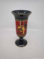 full view of vase front showing red figural panel and shape