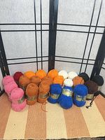 All 23 skeins arranged by color in front of screen