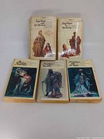 Front covers of all five Angélique paperbacks