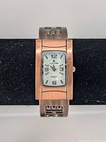 Front view of Louis Arden bronze-tone rectangular quartz bangle watch