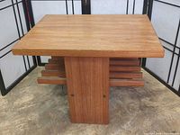 Front angled view showing top, pedestal base and slatted shelf