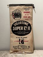 Full view of flattened Vigortone Super 8 50 lb feed bag showing graphics and text