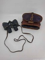 Binoculars with leather case and strap