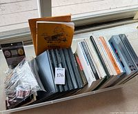 Overall bin with books, manuals, patches, microWINGS kit