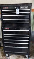 Front view of stacked black Craftsman tool chest with drawers
