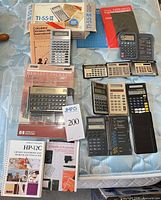 All calculators and manuals laid out on mattress