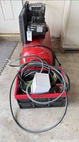 Full view of Craftsman air compressor with crate of accessories