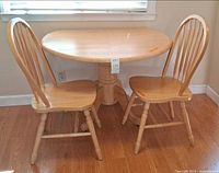 Pedestal drop-leaf table with two matching chairs
