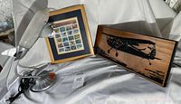 All three items: framed stamp sheet, airplane desk lamp, wooden airplane plaque