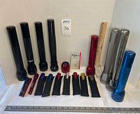 Group shot of all flashlights, bulb pack and spare head