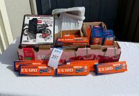 Overall lot with Schumacher Battery Extender box and multiple XADO Revitalizant boxes in carton