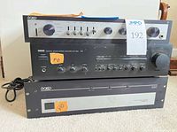 Front view of all three components stacked: QED Model 7 on top, Yamaha AVX-500 middle, QED 330 bottom