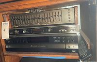 Front view showing AudioControl C-101 equalizer, dbx 3BX expander, Sony CDP-CE500 changer stacked in rack