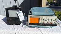Front view of TMK 755C TV and Tektronix 2213A oscilloscope with cover