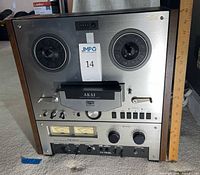 Front view showing full unit, reel hubs, controls, wood sides