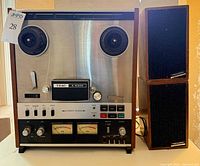 Front view of TEAC A-6300 deck flanked by both Realistic speakers
