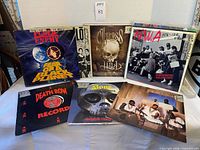 Six featured records laid out showing front covers