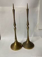 Front view of both brass pricket candle holders