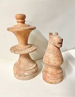 Front view of both marble chess pieces