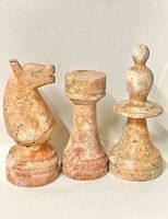 Front view knight, rook, bishop marble pieces