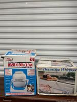 Both boxed appliances side by side