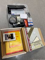 Full lot showing letter trays, tapes, envelopes, hole punch, staples, pens and box containing paper products