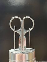 close-up of manicure tools in metal case