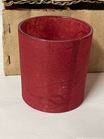 Single red paper maché glass votive holder front view