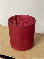 single votive holder showing exterior texture and color