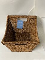 Overall view showing basket shape, tag, handle cutouts