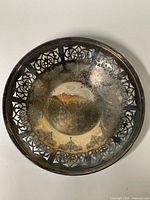 Top view showing pierced rim and tarnish