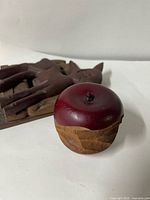 Wooden apple ornament foreground, deer wall art in background