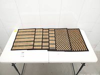 overview of six placemats laid flat on table