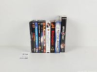 All eleven cases standing upright showing spines