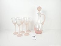 Full set showing decanter, stopper, four of the six glasses visible