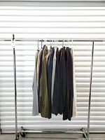 Rack with all 14 long-sleeve tops displayed