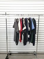 Full rack showing all 16 polo shirts