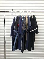 Full rack view showing all 13 T-shirts